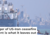 A small motorboat passes anchored vessels in the Strait of Hormuz off Bandar Abbas, Iran, on June 11, 2026. Amirhosein Khorgooi/ISNA via AP
